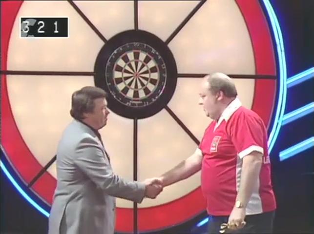 Leighton Rees shaking hands with Tony Green in series 5 of Bullseye