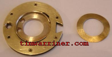 a brass washer and a lock wheel on their own