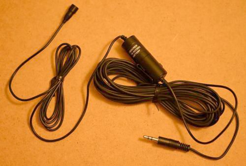 [A tiny microphone connected to a little cylinder with a long wire leading to a little plug]